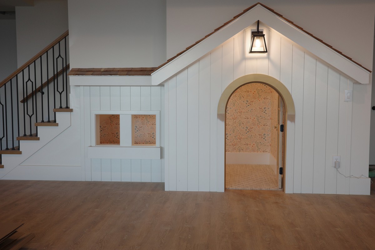 Exterior view of under-stair playroom with Ayara Homes nonwoven wallpaper installation