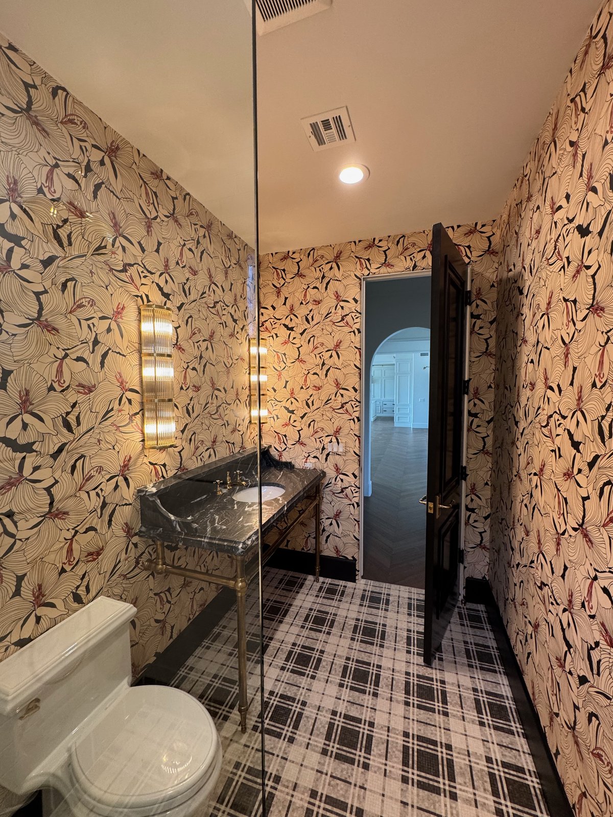 Gucci designer wallcovering professionally installed in bathroom