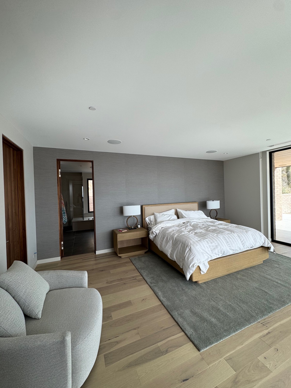 Arte vinyl grasscloth professionally installed on headboard accent wall