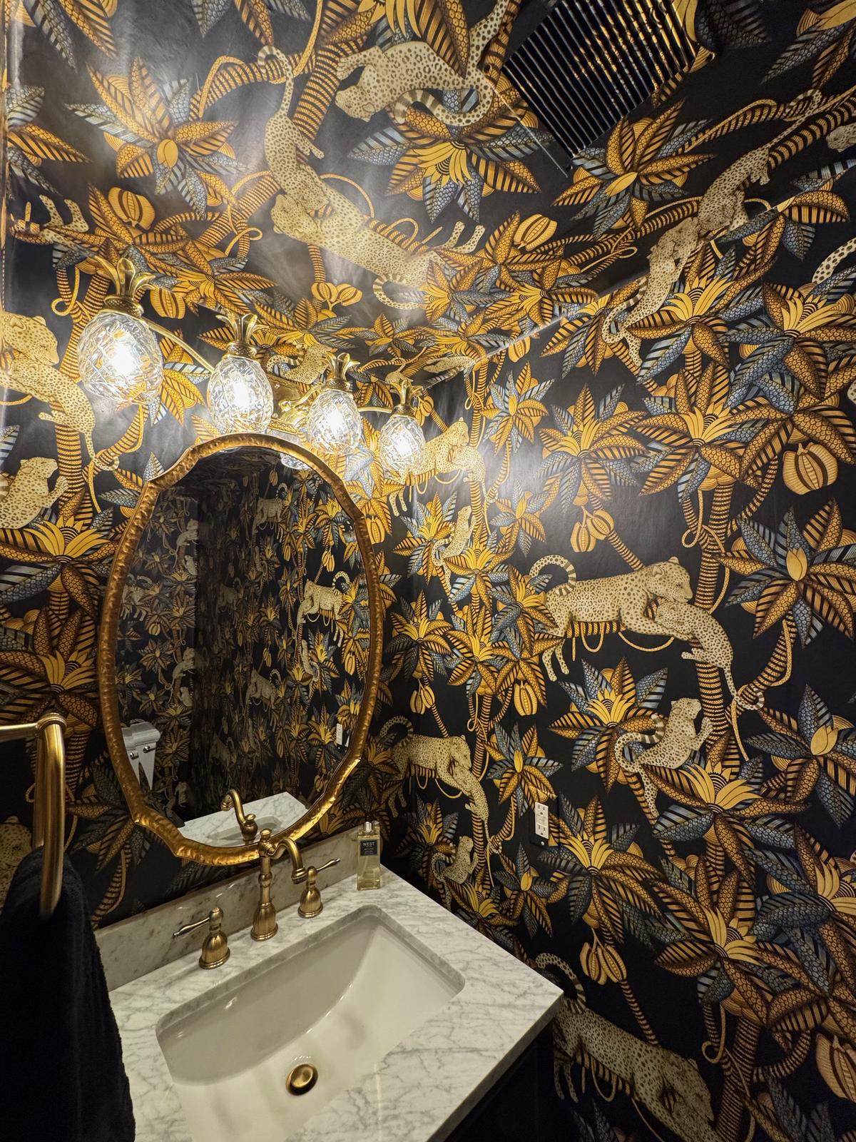 Cole & Sons Jaguar print professionally installed in powder bath