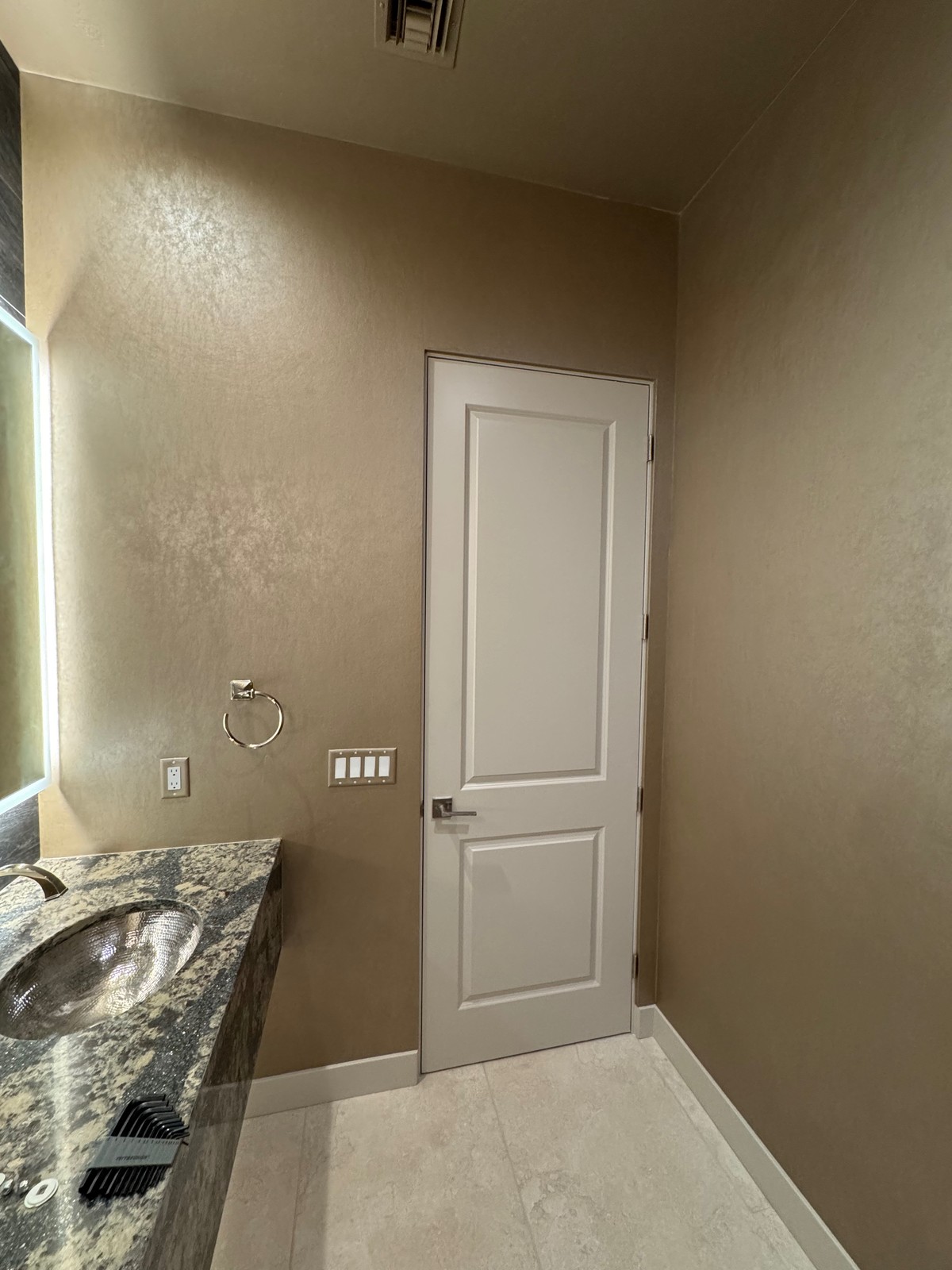 Innovations gold leaf wallcovering installation in powder bath