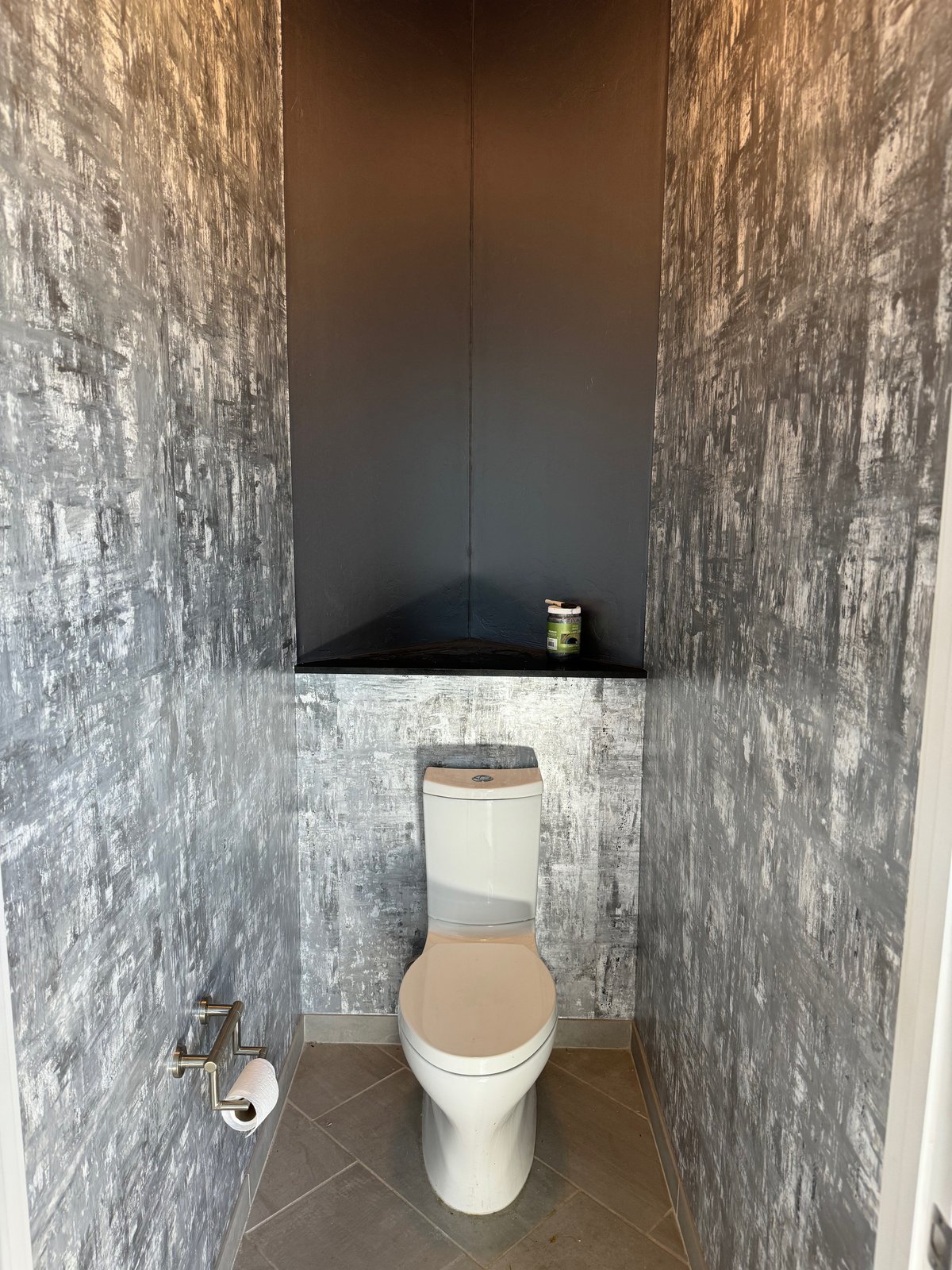 Handpainted metallic wallpaper installation by Vahallan in powder room