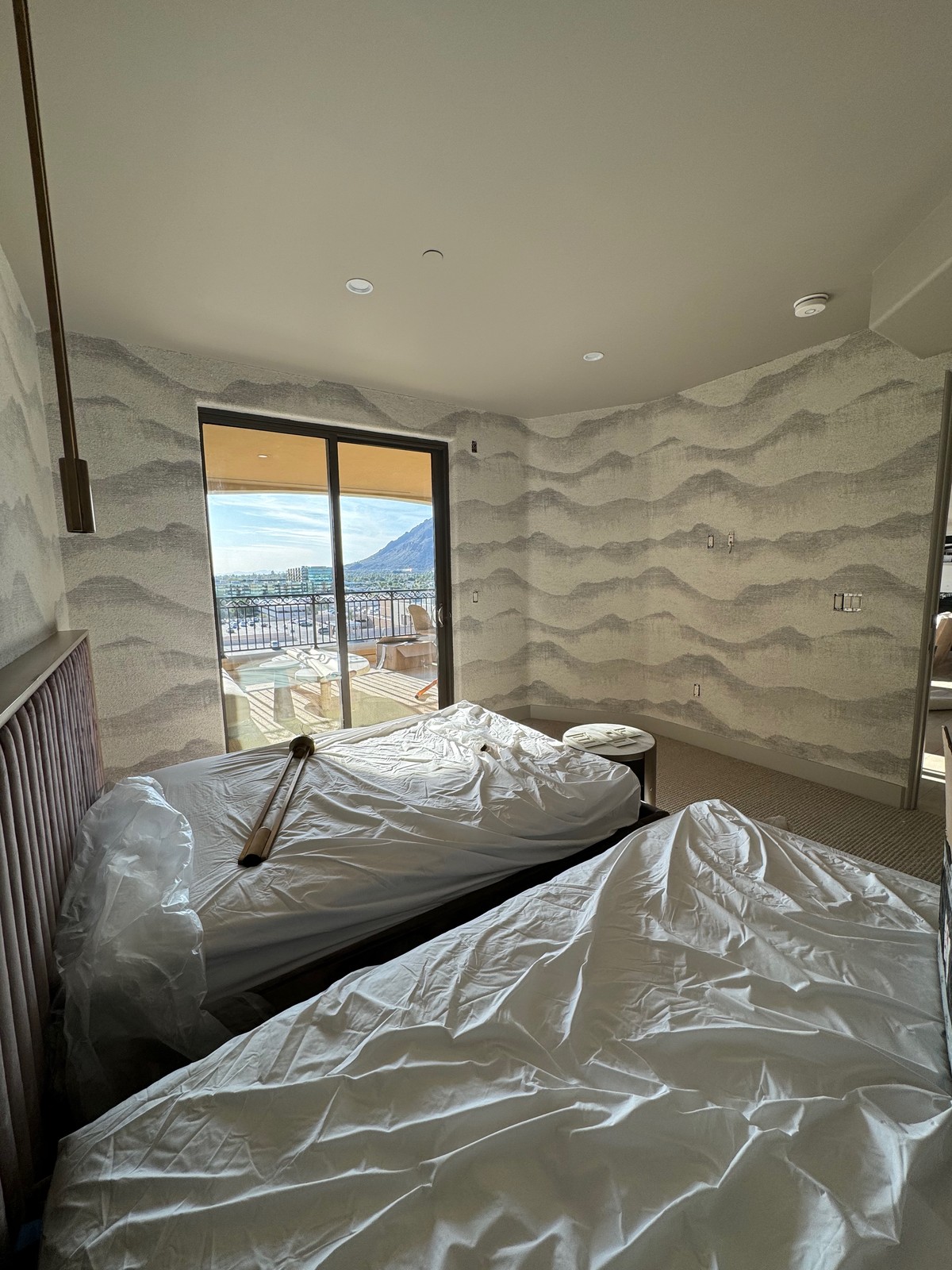 Window wall with wool wallcovering wrapped into reveals